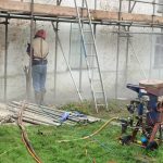 Grit blasting to remove paint and lime coat